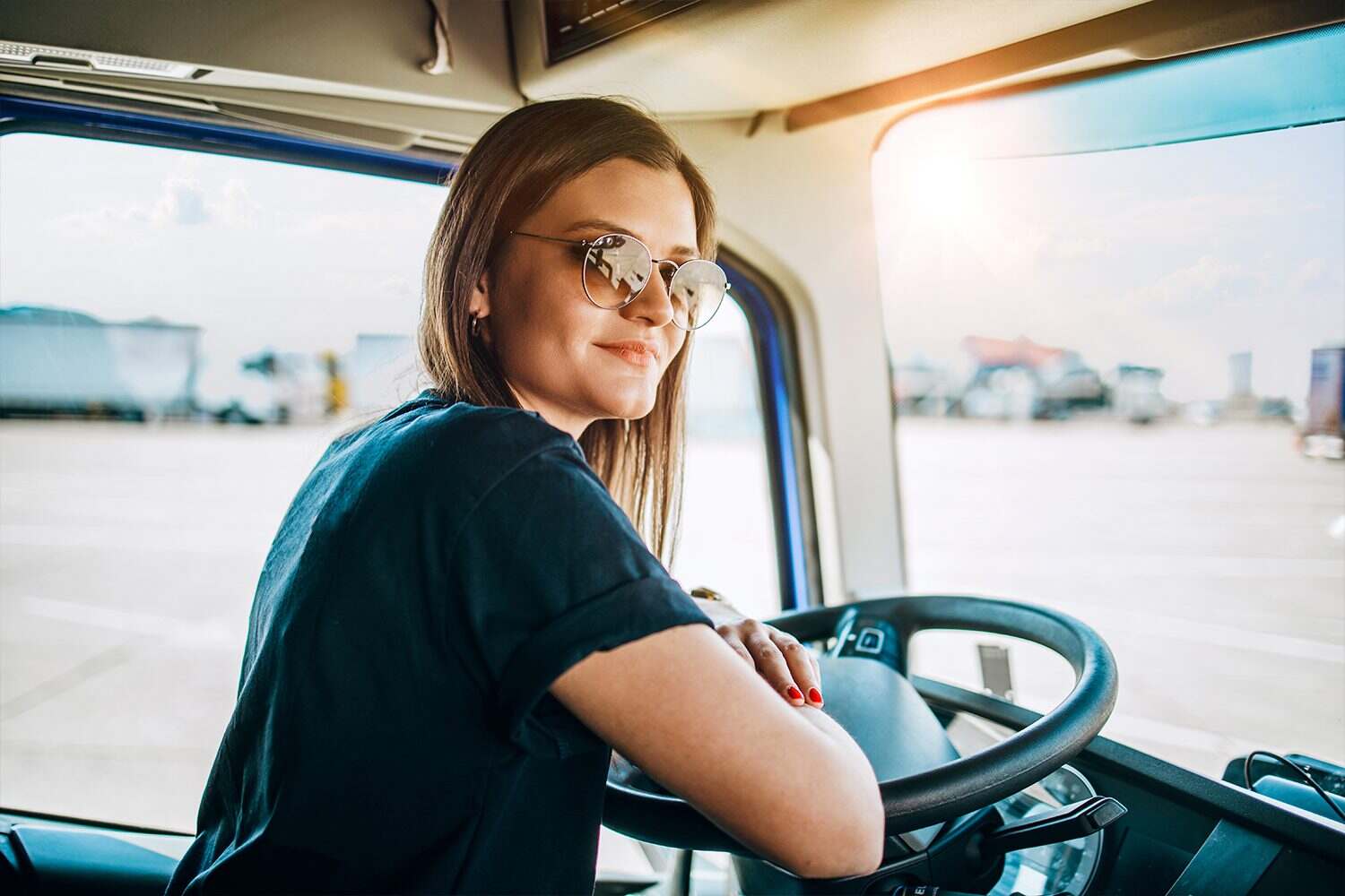 Smiling woman driving truck